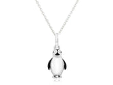 A sterling silver pendant in the shape of a penguin with black and white enamel detailing, attached to a silver chain.